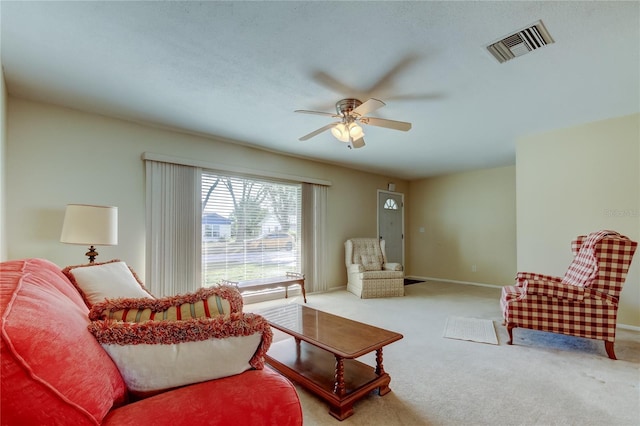 carpeted living room featuring ceiling fan