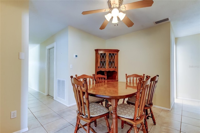 dining room featuring ceiling fan and light tile patterned flooring