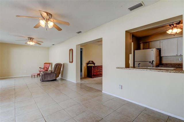 unfurnished room featuring light tile patterned floors