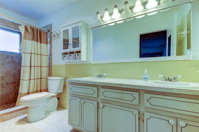 bathroom featuring a shower with shower curtain, vanity, toilet, and tile patterned flooring