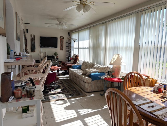 tiled living room with ceiling fan