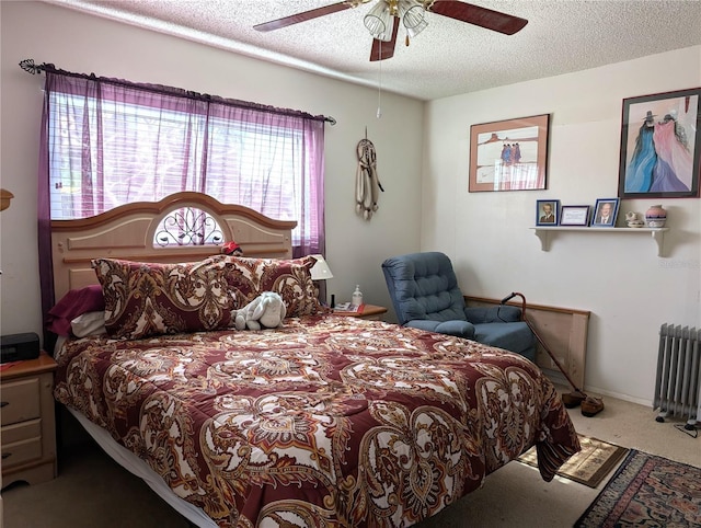 carpeted bedroom featuring a textured ceiling, radiator, and ceiling fan