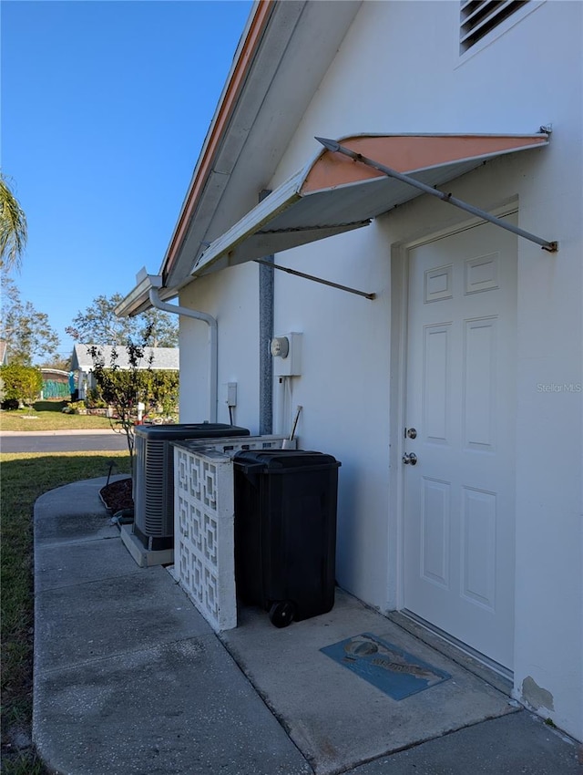 property entrance featuring central AC