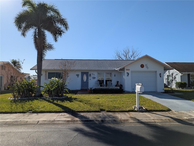 ranch-style home with a front yard and a garage