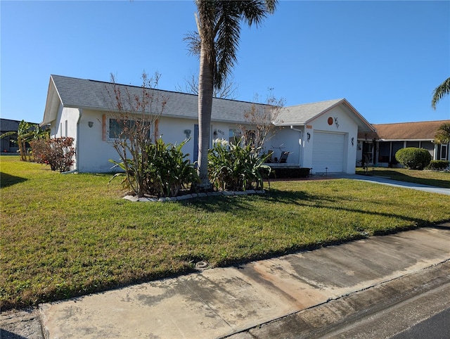 single story home featuring a front yard and a garage