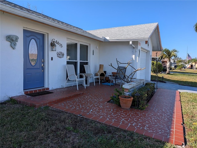 entrance to property featuring a garage