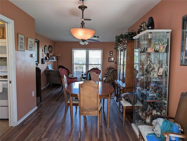 dining room with dark wood-type flooring