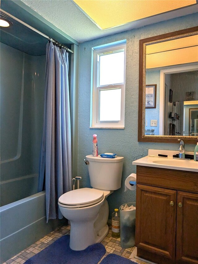 full bathroom featuring tile patterned flooring, shower / bath combo, toilet, and vanity