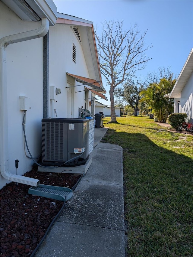 view of yard featuring central AC unit