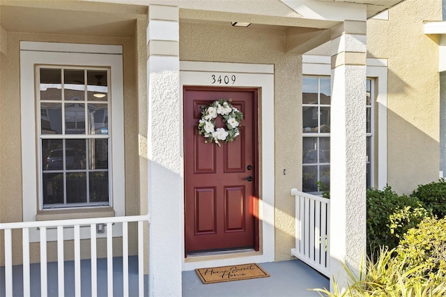 doorway to property with a porch