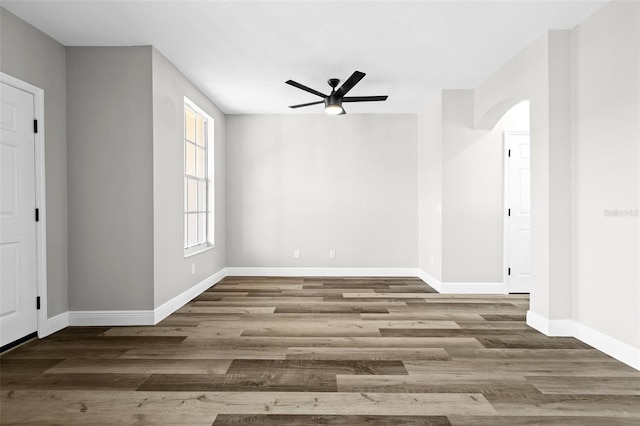 unfurnished room with hardwood / wood-style flooring and ceiling fan