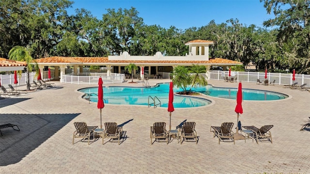 view of swimming pool featuring a patio