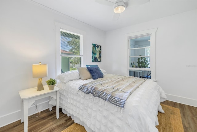 bedroom featuring dark hardwood / wood-style floors and ceiling fan