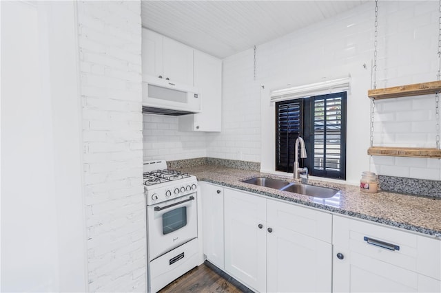 kitchen with white cabinetry, sink, dark wood-type flooring, and white appliances