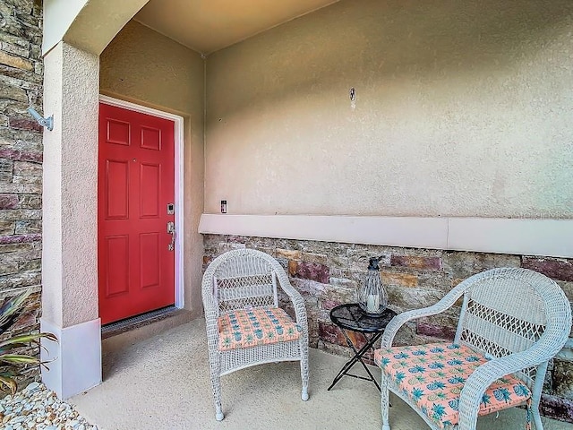 doorway to property with stucco siding