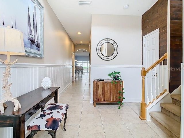 foyer featuring light tile patterned flooring