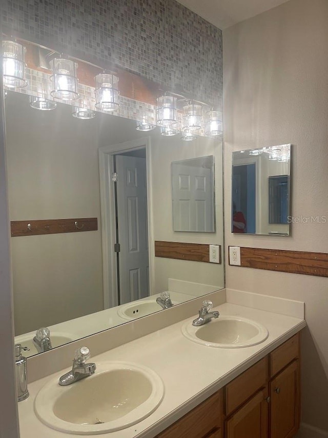 bathroom featuring double vanity and a sink