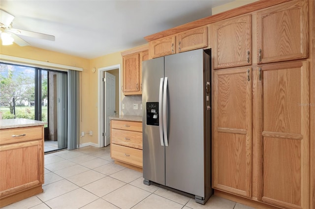 kitchen with light brown cabinets, ceiling fan, decorative backsplash, light tile patterned floors, and stainless steel fridge with ice dispenser