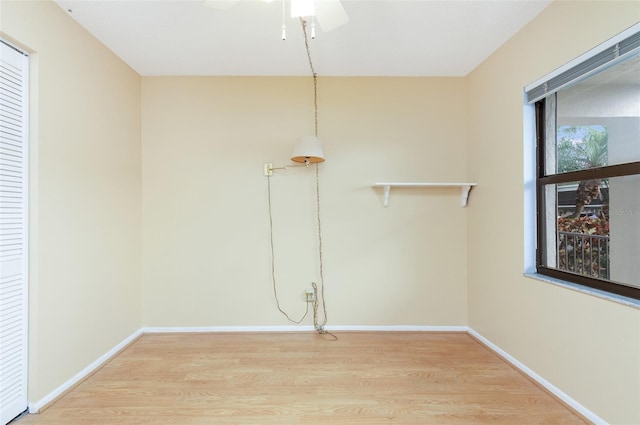 spare room with hardwood / wood-style floors and ceiling fan