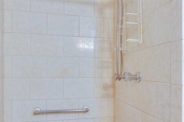 bathroom with tiled shower