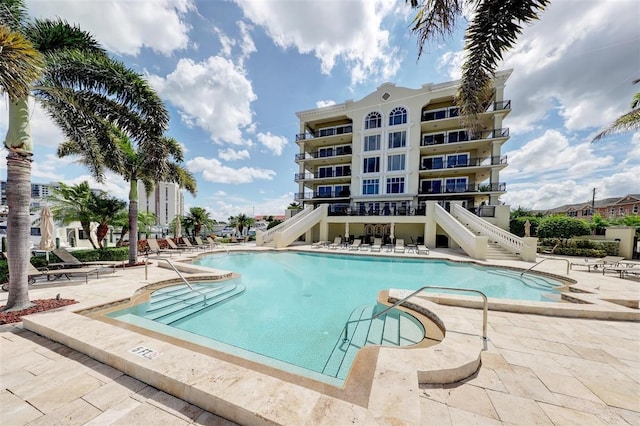 view of swimming pool featuring a patio area