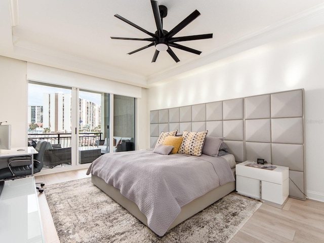 bedroom featuring light wood-type flooring, access to outside, ceiling fan, and ornamental molding