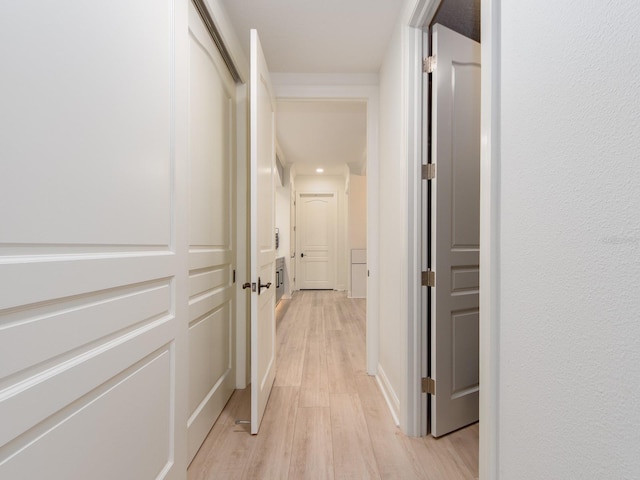 hallway with light wood-type flooring