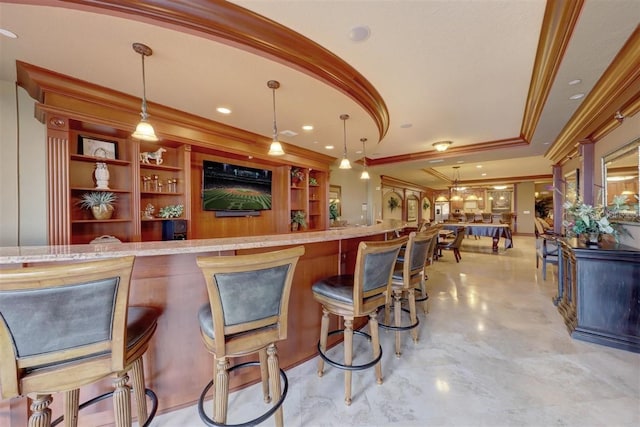 bar featuring pendant lighting and crown molding