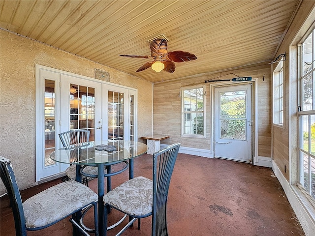 sunroom with french doors, ceiling fan, and wood ceiling