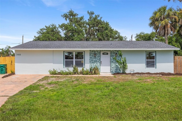 ranch-style home with a front yard