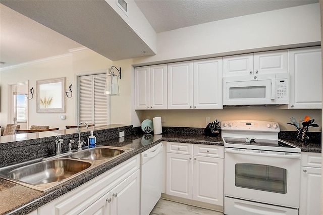 kitchen with sink, kitchen peninsula, crown molding, white appliances, and white cabinets