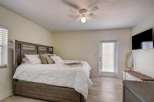 bedroom with ceiling fan and light wood-type flooring