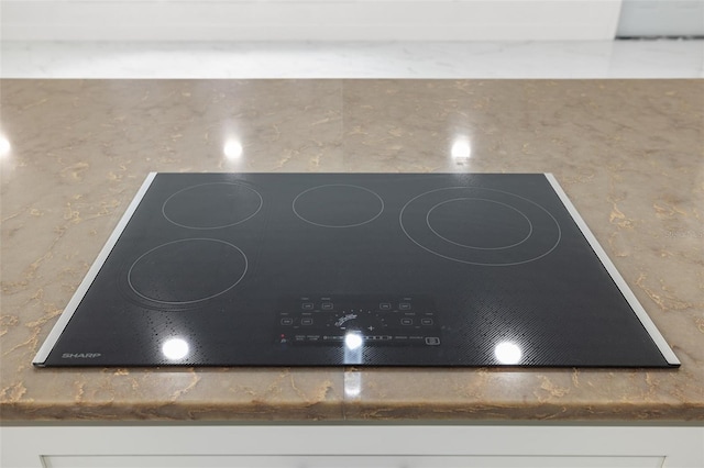 room details featuring black electric cooktop