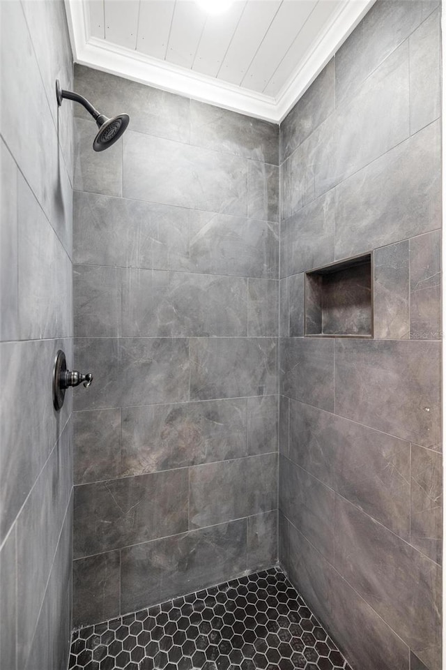 bathroom with tiled shower