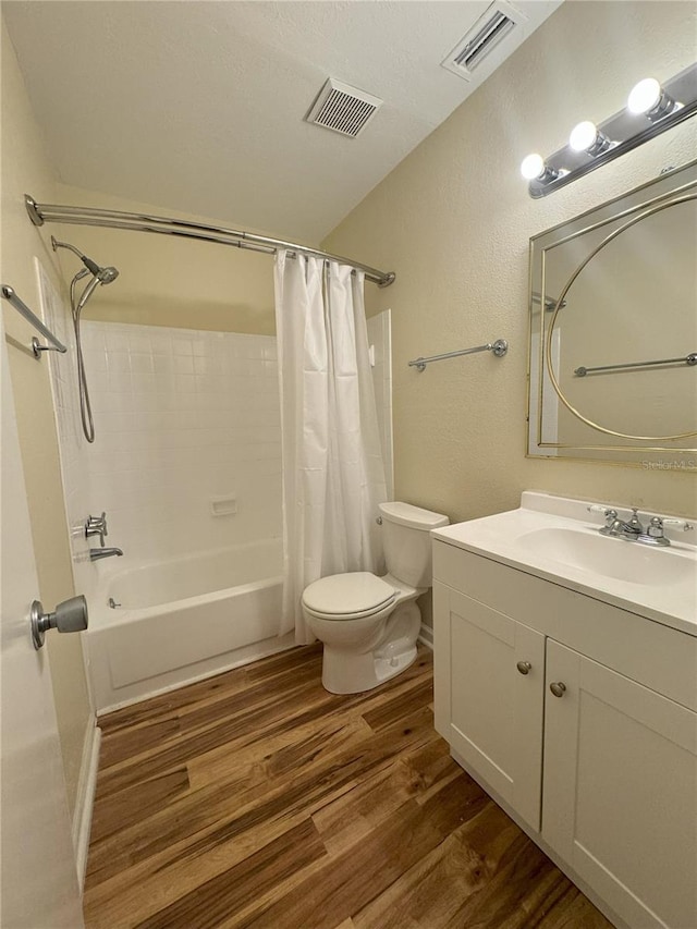 full bathroom with vanity, hardwood / wood-style flooring, toilet, and shower / bathtub combination with curtain