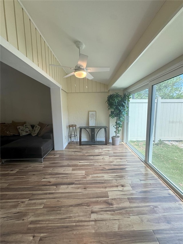 interior space with ceiling fan and lofted ceiling