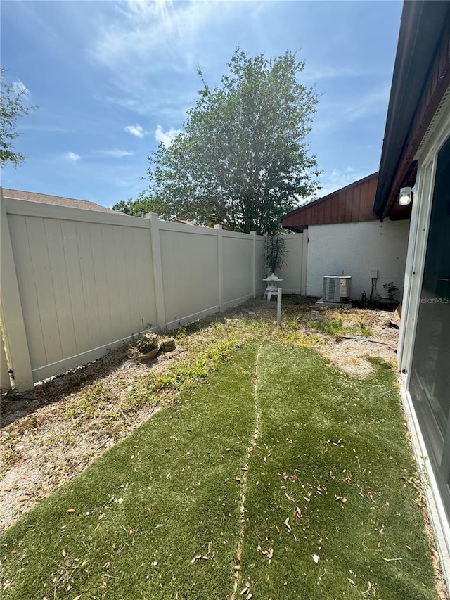 view of yard featuring central AC unit