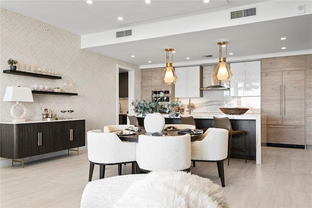 dining area featuring light tile patterned floors