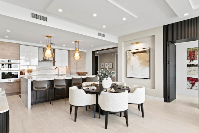 dining room featuring sink