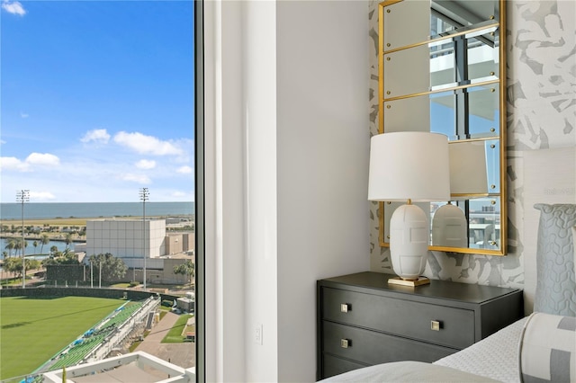 unfurnished bedroom featuring a water view