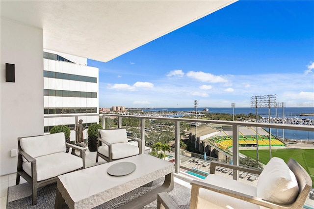 balcony featuring a water view