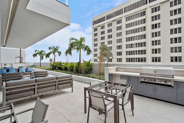 view of patio featuring a grill, an outdoor living space, and area for grilling