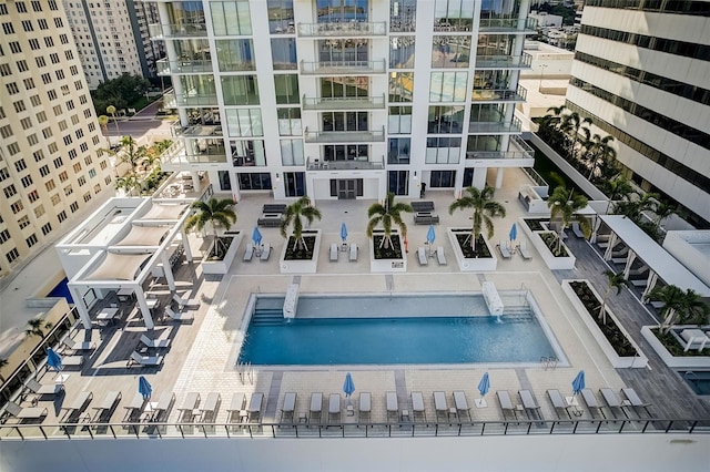 view of swimming pool with pool water feature