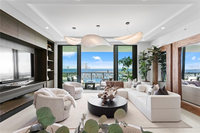 301 1st St S Unit 1002, Saint Petersburg, FL 33701 - living room with recessed lighting, a wall of windows, and a water view
