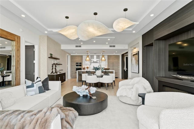 301 1st St S Unit 1002, Saint Petersburg, FL 33701 - living room featuring visible vents, recessed lighting, a raised ceiling, and light wood-type flooring