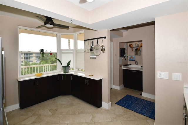 kitchen featuring ceiling fan and light tile patterned flooring