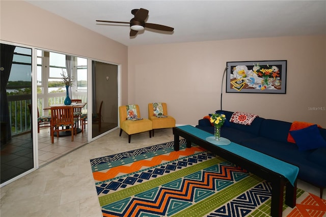 tiled living room with ceiling fan