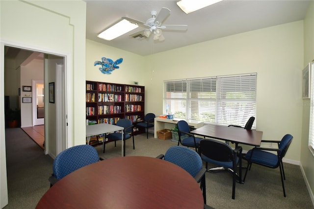 home office with ceiling fan and carpet floors