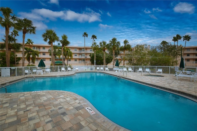 view of swimming pool with a patio