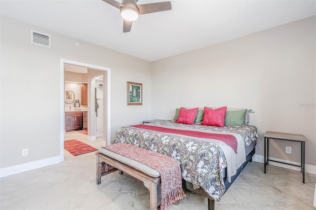 bedroom with ensuite bathroom and ceiling fan